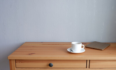 Fototapeta na wymiar A Cup of coffee on a wooden table. Suitable for background and mockup