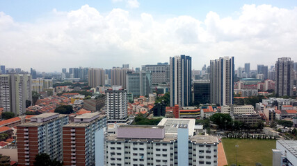 Naklejka premium aerial view of big building including condominium and HDB of city in singapore,selective focus, selective focus on subject, background blur