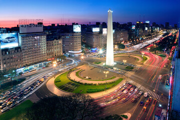 Aerial view of Buenos Aires, at Twilight, along 9 of July Avenue.  - obrazy, fototapety, plakaty