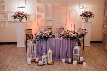 Wedding table for the newlyweds. Table setting and decorations.