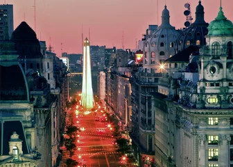Poster Aerial view of obelisk, along Avenue, at twilight, with pink color sky, and city lights. Buenos Aires, Argentina. © Bernardo Galmarini