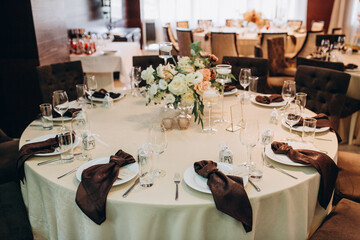 Banquet table setting and decoration. Cutlery on the table.