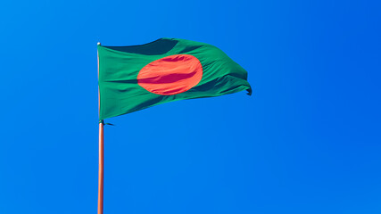 Bangladesh flag flying high on a stand