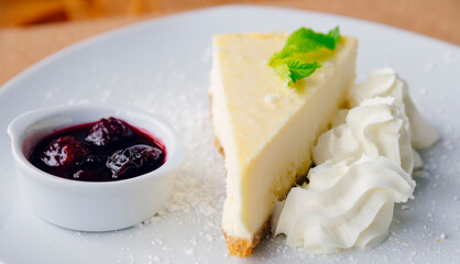 Slice of cheesecake and fruits