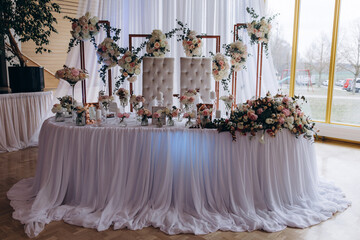 Wedding table for the newlyweds. Table setting and decorations.