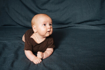 Newborn boy lying on a blanket. Small Caucasian child