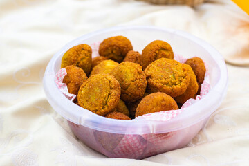 Fried homemade chickpea falafel balls in bowl. Vegan food.