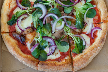 Pizza Margherita on black stone background. Homemade Pizza Margarita with Tomatoes, Basil and Mozzarella Cheese