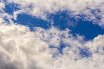 Naklejka na ściany i meble Light cumulus clouds in the blue sky