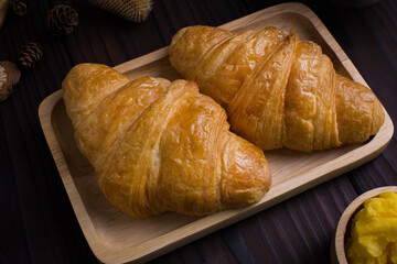 Close up freshly croissants breakfast  on wooden background 