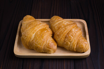 Freshly croissants on wooden 