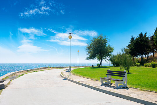 bench on the sea embankment. summer vacation and beach relax concept. nessebar beautiful travel destination of bulgaria. sunny weather