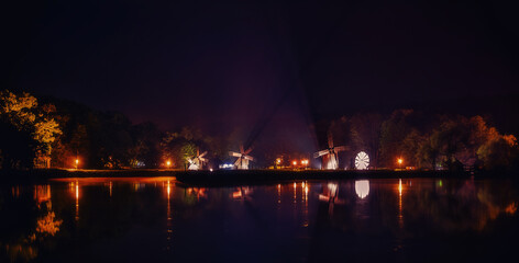 Naklejka na ściany i meble Lake night scene with windmills, Sibiu, Romania