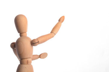 Wooden figure mannequin posing in action isolated on white background.