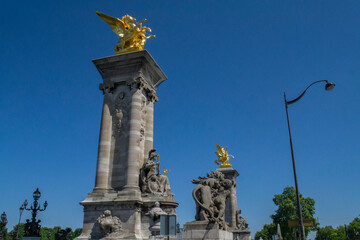 Fototapeta na wymiar part of the decoration of the Alexander III bridge in Paris