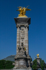Fototapeta na wymiar part of the decoration of the Alexander III bridge in Paris