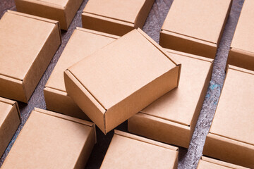 Set of brown cardboard boxes on dark background