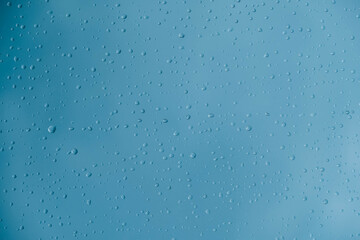 Water drops on a transparent polythene after a rain as a background image. Top view. Copy, empty space for text