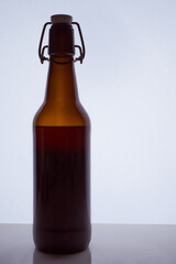 colored silhouette of a beer bottle with a cork on a black white background