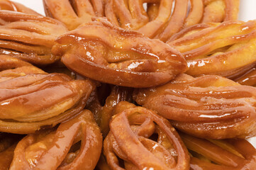 Deep-fried cookies until golden brown, then coated with honey.