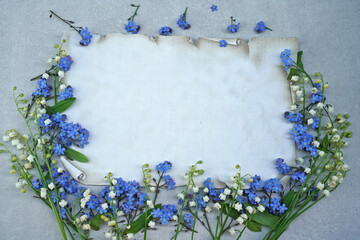 Spring flowers frame with paper 