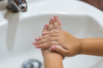 Kid wash hands, new normal for covid-19