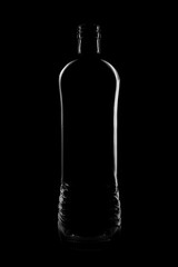 Silhouette of a bottle with a beautiful shape on a black background