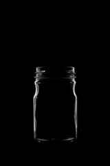 Silhouette of a bottle with a beautiful shape on a black background