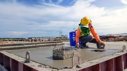 The worker is making plaster concrete segment .