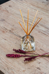 Aromatic air freshener in a transparent square glass bottle