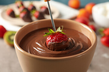 Strawberry in chocolate, close up. Chocolate fondue