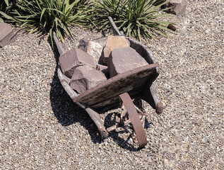 Old wooden trolley for transportation of stones, goods.