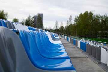 Multi-colored seats in a sports stadium.