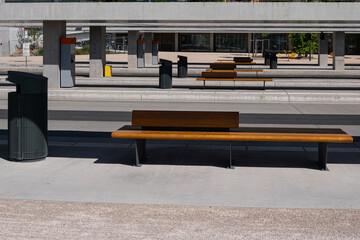 The public transport stop is made of concrete.