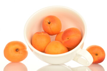 Ripe sweet, organic apricots, close-up, on a white background.