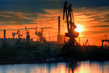 Fototapeta premium Industrial area with cranes and chimenies, in the port of Buenos Aires.