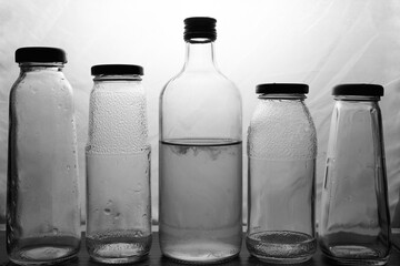 composition of glass bottles on a light background