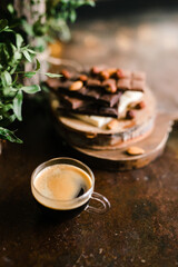 espresso and chocolate bars on a Board with nuts