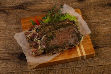 Raw marinated pork steak