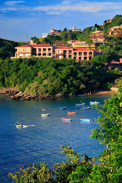 Coast of Buzios, with fisghing boats and coast, at sunset.