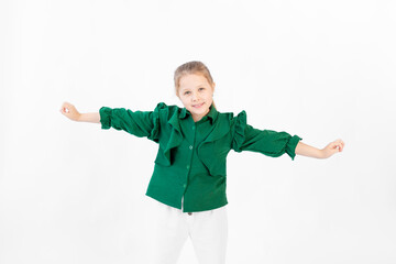 beautiful girl on a white background rejoices hands out, 8 years old, space for text
