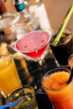 colorful dinks on wooden bar table close up
