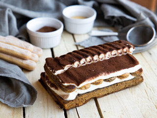 Tiramisu. Traditional italian dessert on wooden background. coffee break