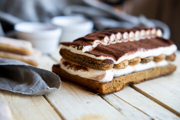 Tiramisu. Traditional italian dessert on wooden background. coffee break