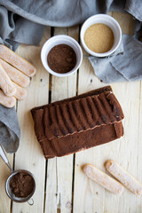 Tiramisu. Traditional italian dessert on wooden background. coffee break