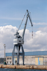 Fototapeta na wymiar Industrial harbor crane in the seaport