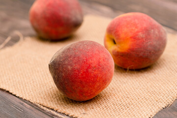 Fresh peaches on the garden table