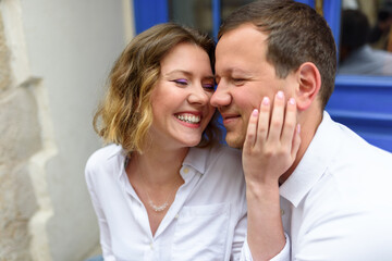 Fototapeta premium Man and woman on a date. The girl snuggles up to her boyfriend.