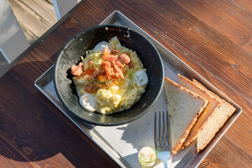 Scrambled eggs with salmon and chives