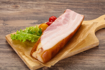 Smoked pork breast with salad leaves